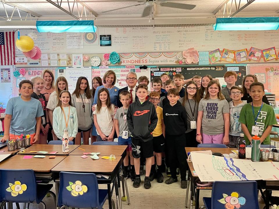 Governor Mike DeWine poses with Heath students and teachers Wednesday after visiting Stevenson Elementary.