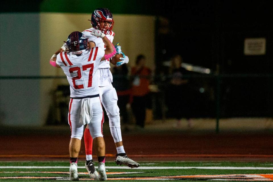 Hancock’s Neil Acker and Jeffery Hopgood celebrate after a touchdown during a game at West Harrison High School in Harrison County on Friday, Oct. 6, 2023. Hannah Ruhoff/Sun Herald