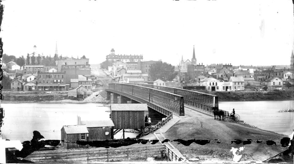 This photo provided by Lee County Historical and Genealogical Society shows the Truesdell Bridge in Dixon, Ill., in 1873. It's been 150 years since the bridge collapsed, remaining the worst road-bridge disaster in American history. On May 4, 1873, a crowd of more than 200 gathered on the bridge to watch a baptism when it toppled over, trapping dozens of victims just inches below the river's surface. The disaster claimed 46 lives and injured dozens of others. (Charles Keyes/Lee County Historical and Genealogical Society via AP)