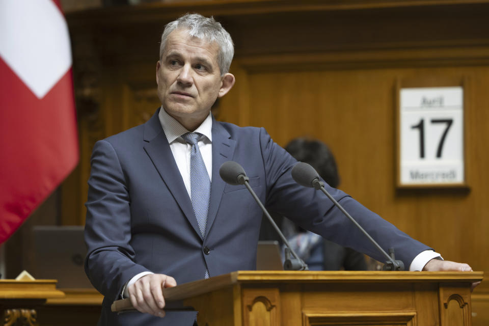 Switzerland's Federal Councilor Beat Jans, speaks during a special session of the National Council, in Bern, Switzerland, Wednesday, April 17, 2024. The lower house of Swiss parliament on Wednesday followed in the footsteps of the Senate, or upper house, in approving a measure that would ban the use of, public wearing or display of Nazi and racist symbols that could foment extremist hate or violence. (Peter Klaunzer /Keystone via AP)