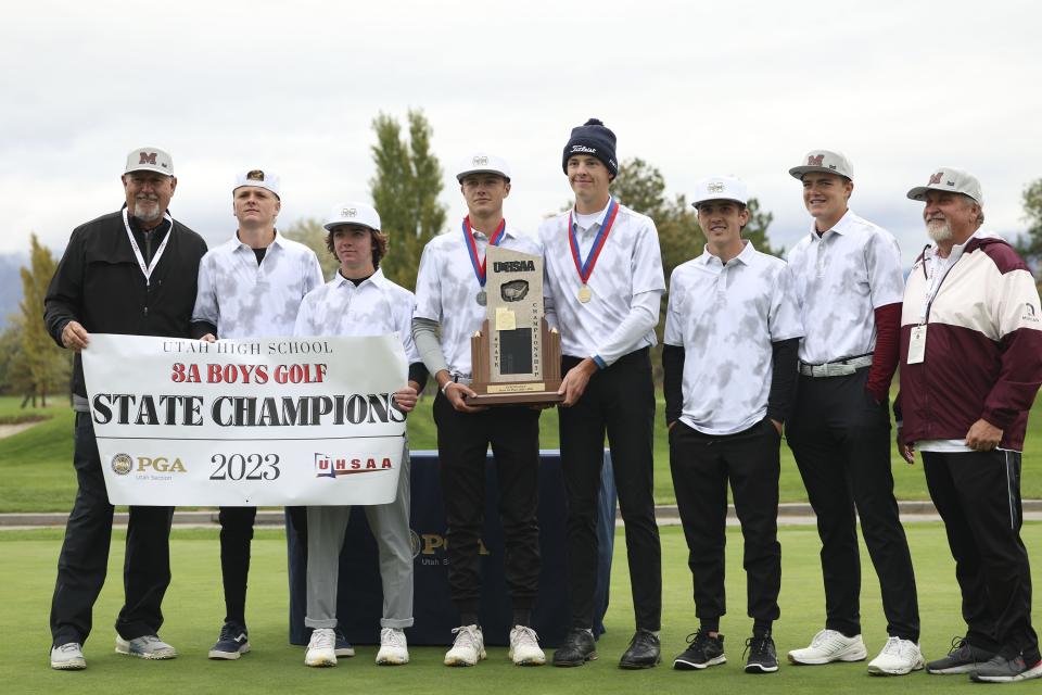 Morgan High School golfers hold their 3A state championship trophy at Meadow Brook Golf Course in Taylorsville on Thursday, Oct. 12, 2023. | Laura Seitz, Deseret News