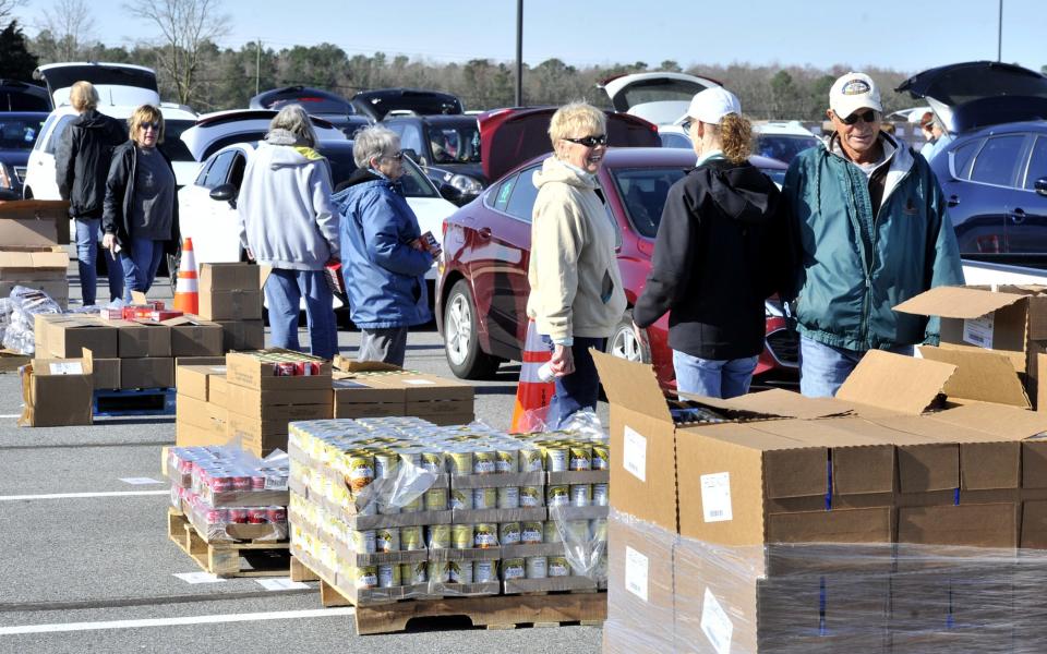 More than 100 volunteers from all over Sussex County helped distribute food at a Food Bank of Delaware event on Monday, March 27, 2023.