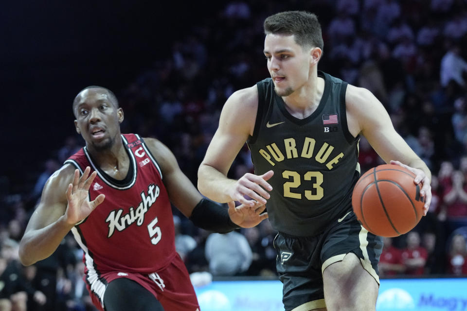 Purdue forward Camden Heide (23) drives to the basket past Rutgers forward Aundre Hyatt (5) in the first half of an NCAA college basketball game, Sunday, Jan. 28, 2024, in Piscataway, N.J. (AP Photo/Mary Altaffer)