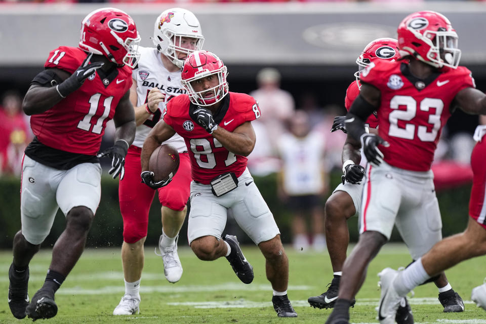 Georgia's Mekhi Mews (87) returns a Ball State punt for touchdown in the first half of an NCAA college football game Saturday, Sept. 9, 2023, in Athens, Ga. (AP Photo/John Bazemore)