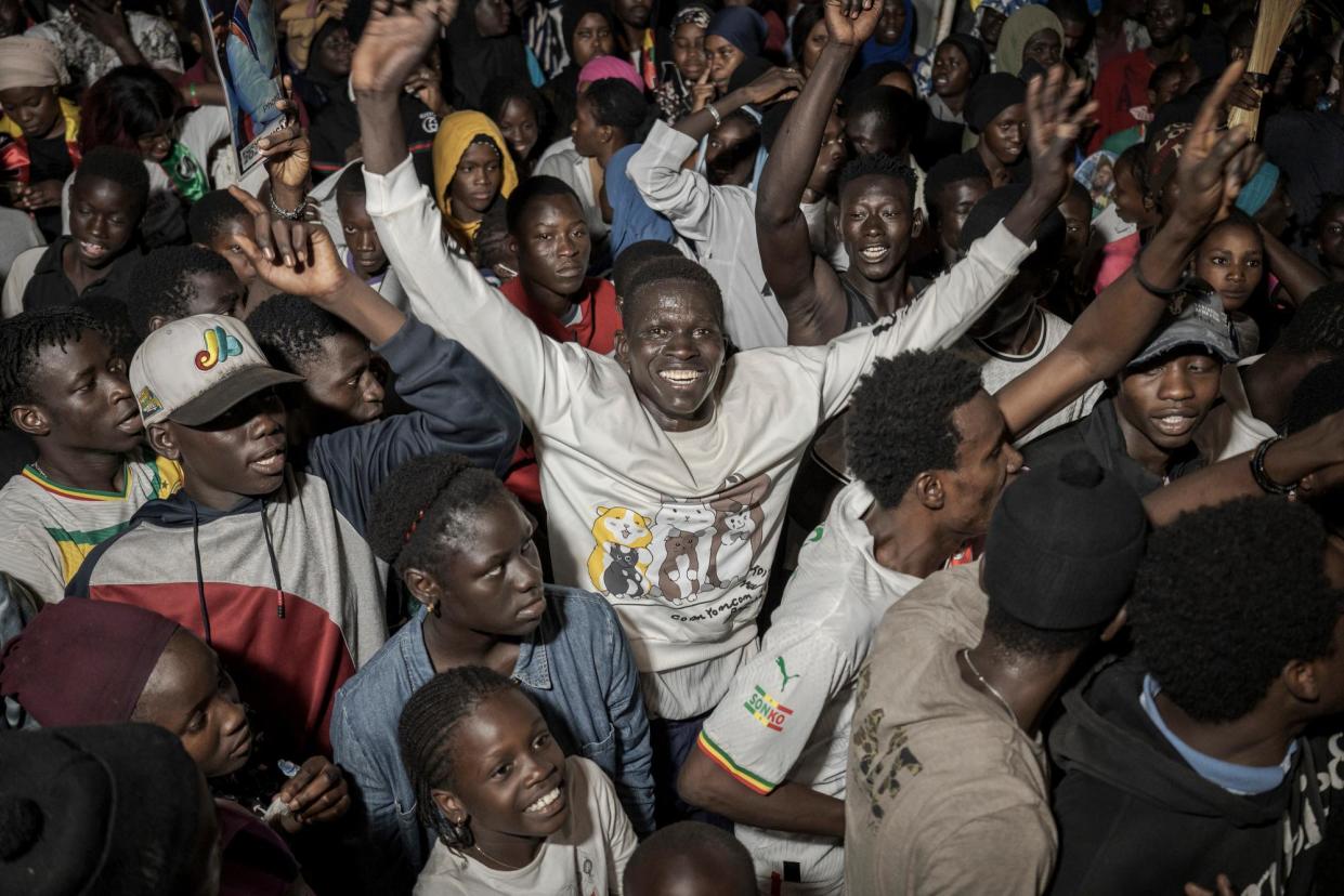 <span>Crowds mark Bassirou Diomaye Faye’s victory.</span><span>Photograph: Annika Hammerschlag/The Guardian</span>