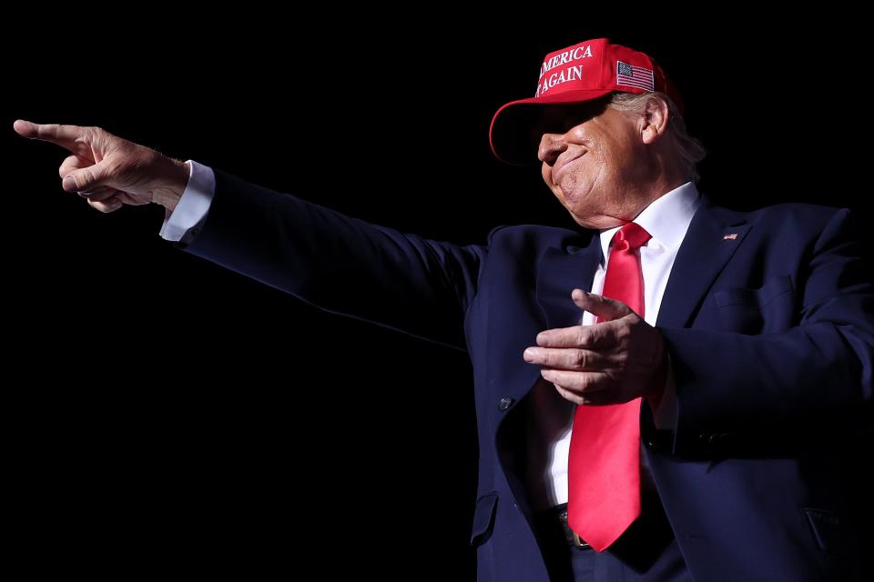 Former President Donald Trump points to supporters after speaking at a rally Nov. 5, 2022, at the Arnold Palmer Regional Airport in Latrobe, Pennsylvania. Trump campaigned for Pennsylvania Republican candidates including Republican Senate candidate Dr. Mehmet Oz and Republican gubernatorial candidate Doug Mastriano ahead of the midterm elections to be held on Nov. 8.