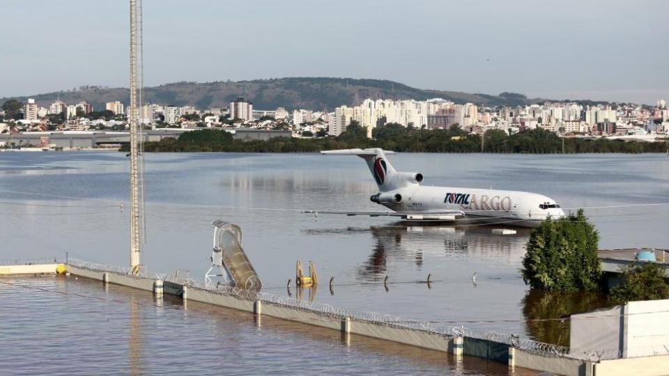 A cargo plane sits on a flooded runway at the airport in Porto Alegre, Rio Grande do Sul, Brazil, May 6, 2024