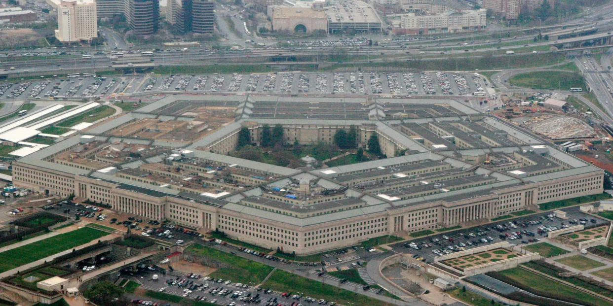 FILE - This March 27, 2008, aerial file photo, shows the Pentagon in Washington.  The Pentagon is reconsidering its awarding of a major cloud computing contract to Microsoft after rival tech giant Amazon protested what it called a flawed bidding process. U.S. government lawyers said in a court filing this week of March 13, 2020  that the Defense Department “wishes to reconsider its award decision” and take another look at how it evaluated technical aspects of the companies' proposals to run the $10 billion computing project. (AP Photo/Charles Dharapak, File)