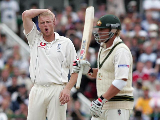 England’s Andrew Flintoff looks dejected after another chance to dismiss Shane Warne goes 