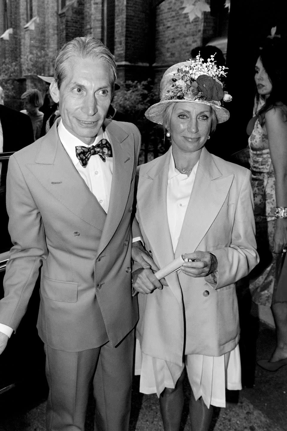 <p>Charlie Watts and his wife Shirley Ann Shepherd, attend Georgia May Jagger's christening at Saint Andrew's church, Richmond in 1992.</p>