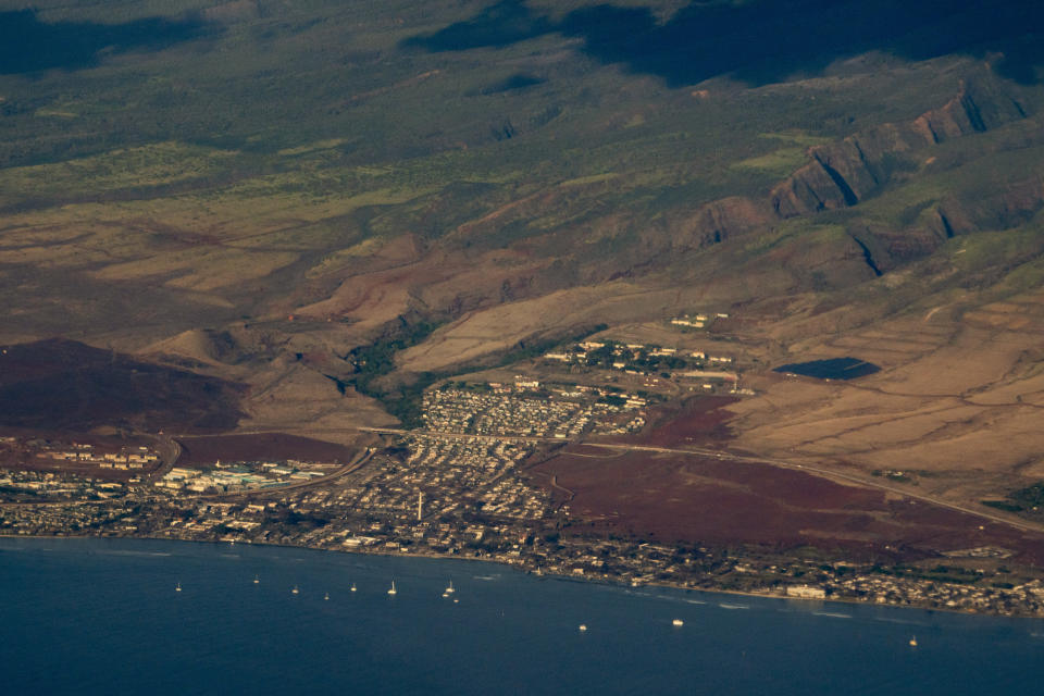 The town of Lahaina is pictured Tuesday, Dec. 5, 2023, in Hawaii. The heart of Lahaina, the historic Maui town that burned in a deadly Aug. 8 wildfire that killed at least 100 people, reopened Monday, Dec. 11, to residents and business owners who hold a day pass. (AP Photo/Lindsey Wasson)