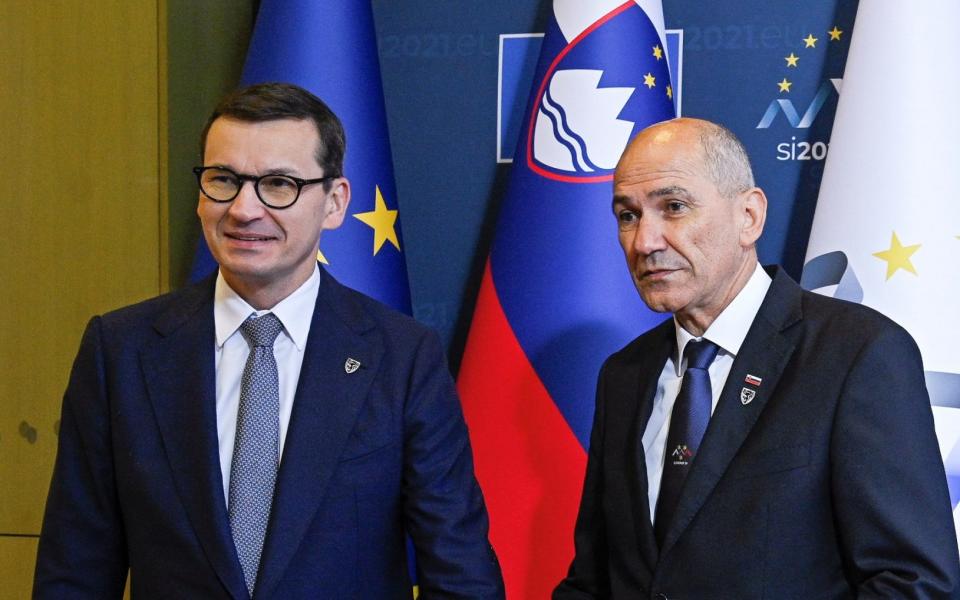 Slovenia's prime minister Janez Jansa (right) welcomes Poland's prime minister Mateusz Morawiecki before EU-Western Balkans Summit - Reuters