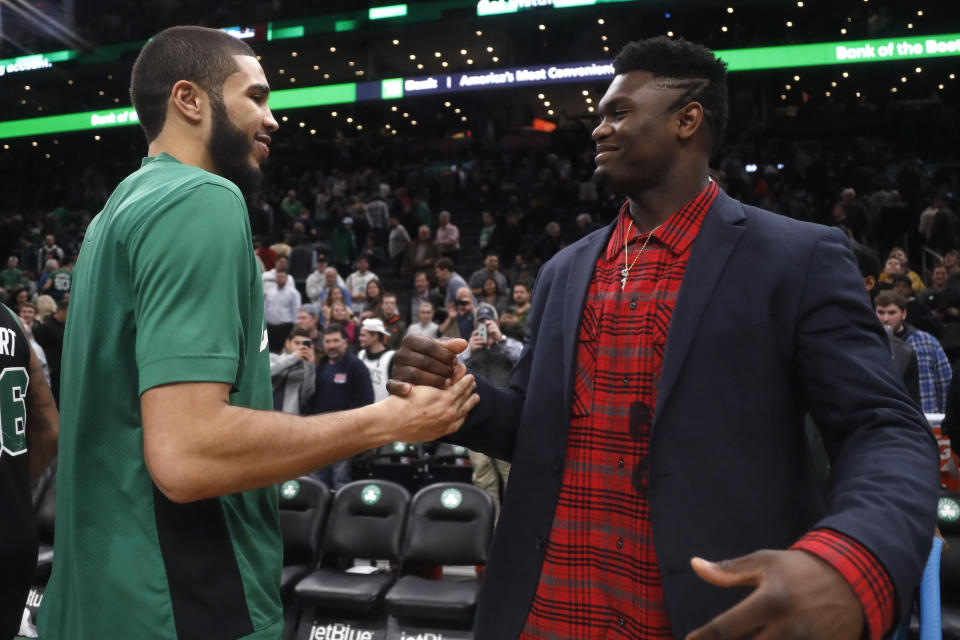 Boston Celtics' Jayson Tatum, left, greets New Orleans Pelicans' Zion Williamson following an NBA basketball game Saturday, Jan. 11, 2020, in Boston. Both played at Duke. (AP Photo/Winslow Townson)