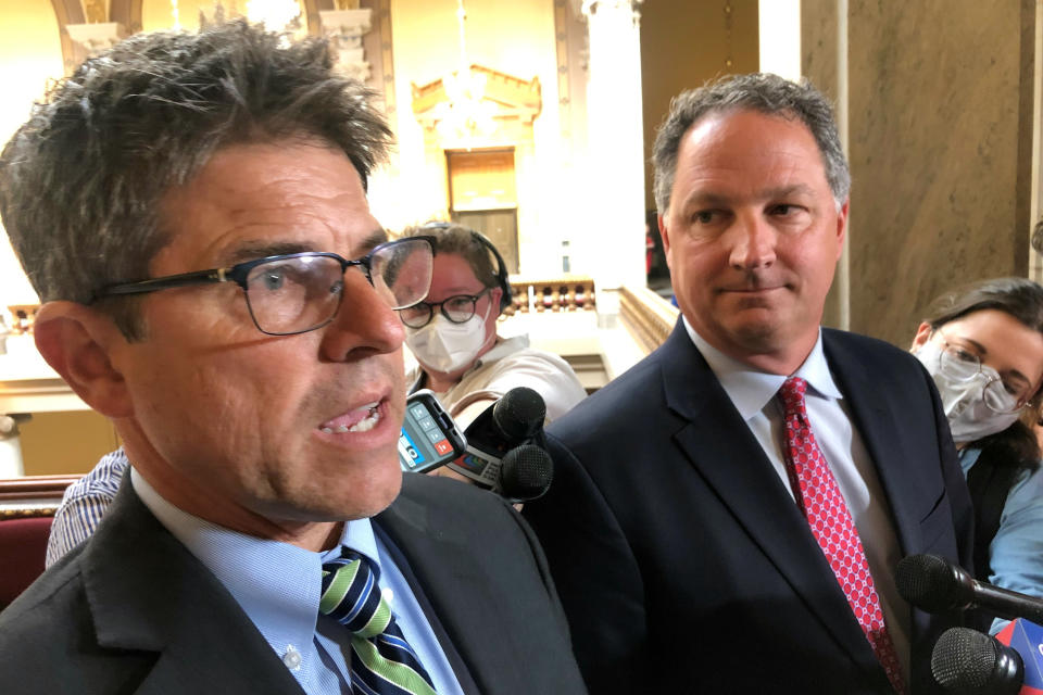 Indiana Senate President Pro Tem Rodric Bray, R-Martinsville, left, speaks with reporters alongside Indiana House Speaker Todd Huston, R-Fishers, at the Statehouse in Indianapolis on Tuesday, May 24, 2022. Bray said he would vote Tuesday to override Gov. Eric Holcomb’s veto of a bill banning transgender females from competing in girls school sports, calling it “a matter of simple fairness” despite the threats of court challenges to the law. (AP Photo/Tom Davies)