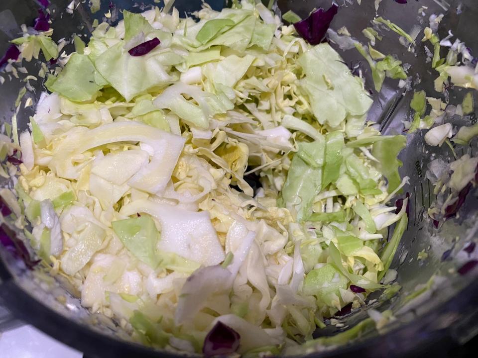 Bowl of shredded cabbage.