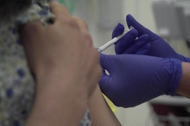 A person being injected as part of human trials in the UK for a coronavirus vaccine at the start of Oxford University vaccine trials: PA