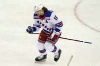 New York Rangers left wing Artemi Panarin (10) skates toward the bench after scoring a goal against the New Jersey Devils during the third period of an NHL hockey game, Tuesday, April 13, 2021, in Newark, N.J. The Rangers shut out the Devils 3-0. (AP Photo/Kathy Willens)