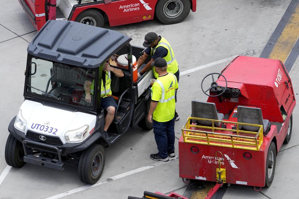 Water is delivered to grounds crew working on the tarmac at Sky Harbor International Airport, Monday, July 10, 2023, in Phoenix. (AP Photo/Matt York)