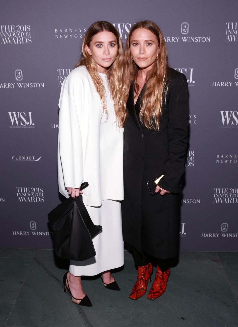 Ashley Olsen, left, and Mary-Kate Olsen, right, attend the WSJ Magazine 2018 Innovator Awards in New York City.