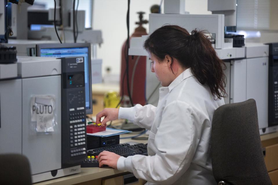 Beth Underwood, forensic scientist in the chemistry section of the Bureau of Criminal Investigation in London, Ohio, breaks down drug samples on Jan. 27. The BCI processed 12,000 samples of meth in 2019, compared with 5,000 in 2017.