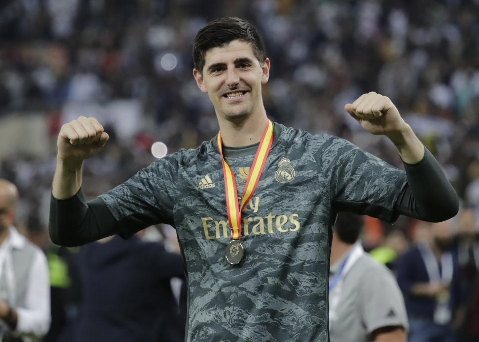 Real Madrid's goalkeeper Thibaut Courtois celebrates at the end of the Spanish Super Cup Final soccer match between Real Madrid and Atletico Madrid at King Abdullah stadium in Jiddah, Saudi Arabia, Monday, Jan. 13, 2020. (AP Photo/Hassan Ammar)