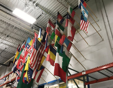 Flags representing the countries of origin of the 900 employees at HydraForce Inc., hang above the factory floor at the firm's plant in Lincolnshire, Illinois, U.S., January 10, 2018. Photo taken January 10 2018. REUTERS/Ann Saphir