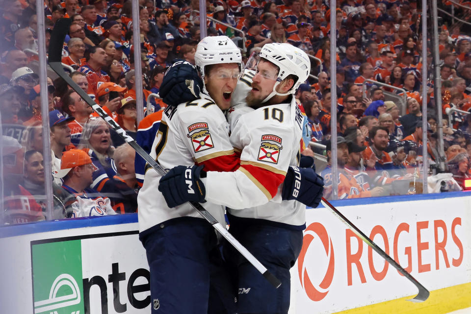 Eetu Luostarinen (L) and Vladimir Tarasenko celebrate after Tarasenko's goal in Game 3. (Bruce Bennett/Getty Images)