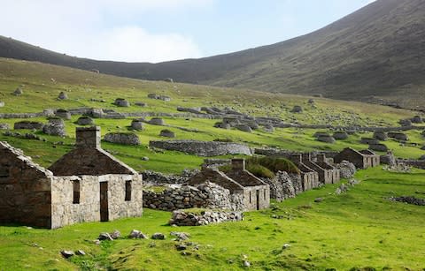 Ancient stone houses on St Kilda - Credit: Getty