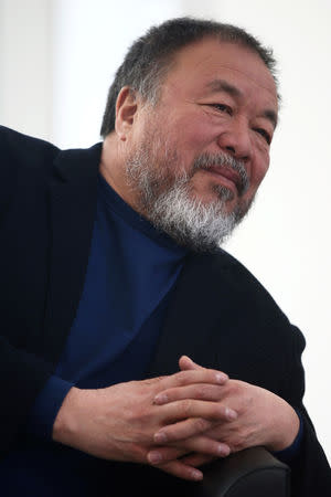 Chinese artist Ai Weiwei gestures during a news conference for his exhibition "Restablecer Memorias" displayed at the University Museum of Contemporary Art (MUAC) in Mexico City, Mexico, April 11, 2019. REUTERS/Edgard Garrido/Files