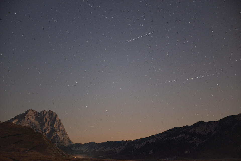 Perseids streak across Gran Sasso d'Italia in L'Aquila, Italy on August 10, 2020.  / Credit: Lorenzo Di Cola/NurPhoto via Getty Images