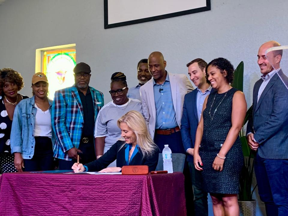 Jacksonville Mayor Donna Deegan signs a bill on Sept. 13, 2024 for a $300 million community benefits agreement between the city and the Jaguars. She signed the bill at In the Word International Church in the Eastside neighborhood.