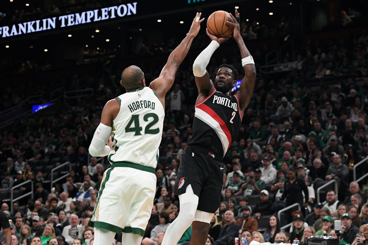 Apr 7, 2024; Boston, Massachusetts, USA; Portland Trail Blazers center Deandre Ayton (2) shoots the ball over Boston Celtics center Al Horford (42) during the first half at TD Garden. Mandatory Credit: Eric Canha-USA TODAY Sports