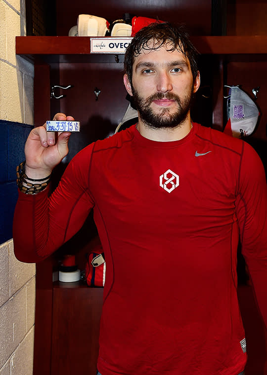 <p>Alex Ovechkin #8 of the Washington Capitals poses with a puck commemorating his 50th goal of the season after an NHL game against the Carolina Hurricanes at Verizon Center on March 31, 2015 in Washington, DC. With his 472th career goal, Ovechkin tied Peter Bondra as the franchise goal leader. (Photo by Patrick McDermott/NHLI via Getty Images) </p>