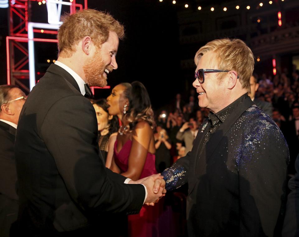 LONDON, ENGLAND - NOVEMBER 13: Britain's Prince Harry greets Elton John after the Royal Variety Performance at the Albert Hall on November 13, 2015 in London, England. (Photo by Paul Hackett - WPA Pool/Getty Images)