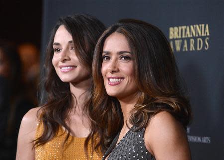 Actors Salma Hayek (R) and Mia Maestro attend the BAFTA Los Angeles Britannia Awards in Beverly Hills, California November 9, 2013. REUTERS/Phil McCarten