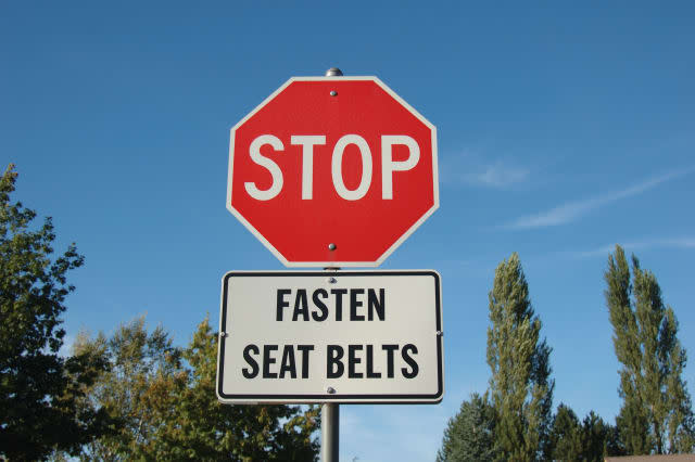 Stop sign and seat belt sign.