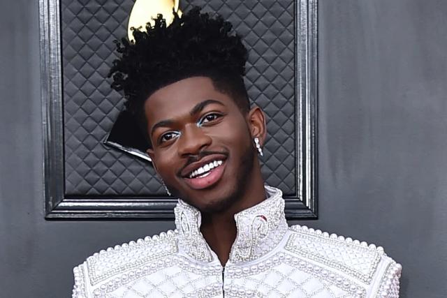 Lil Nas X Is Glamorous in Pearl Jacket, Flare Pants and Extreme Platforms at Grammy Awards 2022