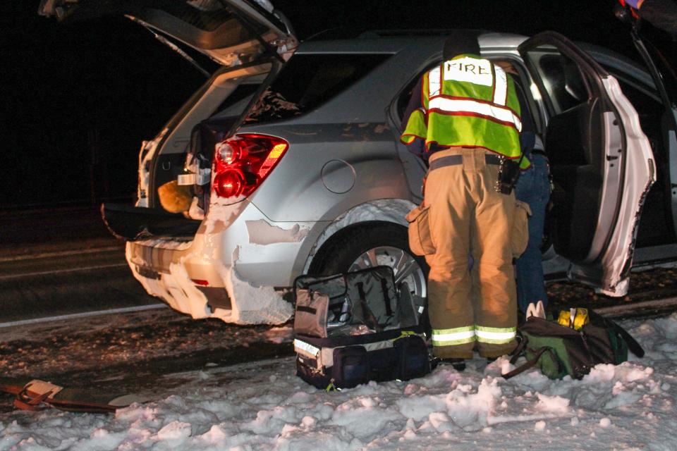 Emergency personnel work the scene the night Amedy Dewey was shot by her stepfather David Somers on the side of Interstate 96 East near the 60 mile marker on Jan. 6, 2018.