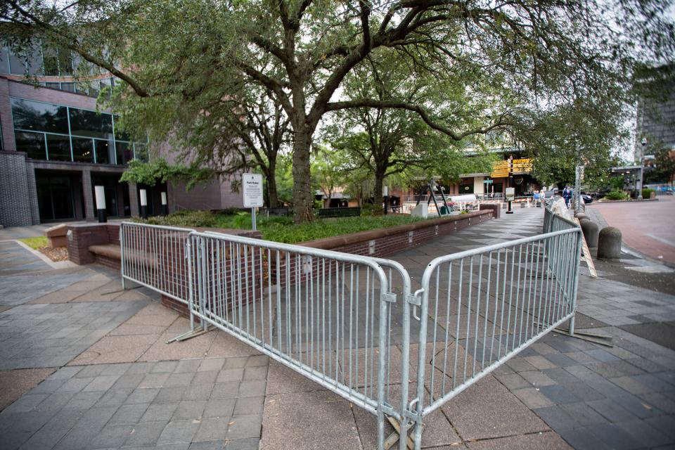 Metal barricades surround the public space outside the Tallahassee City Hall building following the arrests of several activists who were protesting SB 300 Monday evening. 