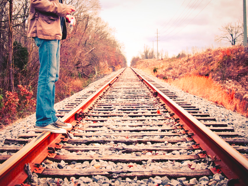 Standing on Railroad Tracks