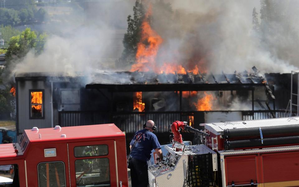 Construction buildings burn near the King County Juvenile Detention Center - AP