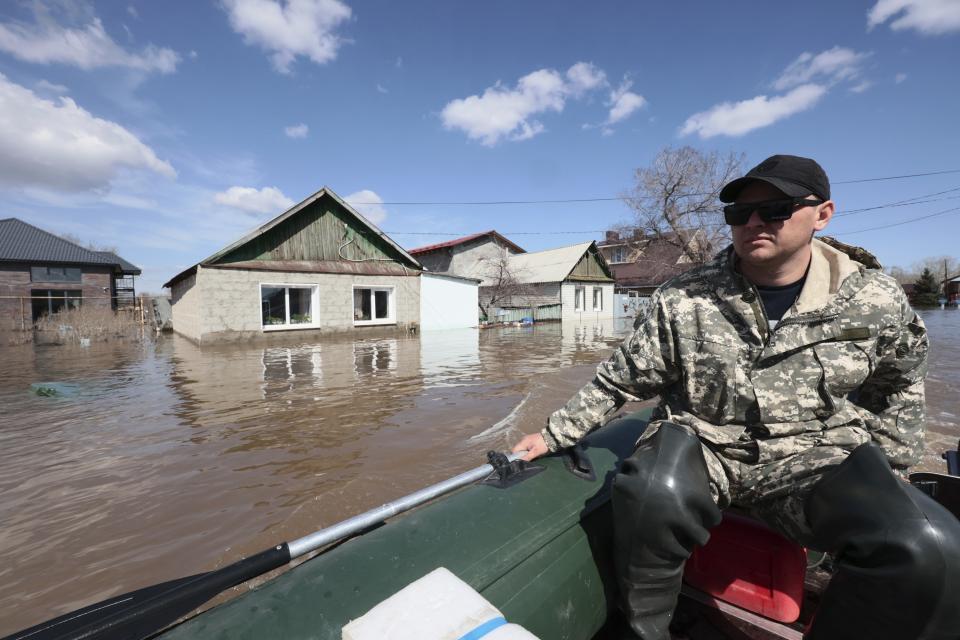 A man rides his rubber boat to help local residents during evacuations from a flooded area in Orenburg, Russia, on Thursday, April 11, 2024. Russian officials are scrambling to help homeowners displaced by floods, as water levels have risen in the Ural River. The river's water level in the city of Orenburg was above 10 meters (33 feet) Wednesday, state news agency Ria Novosti reported, citing the regional governor. (AP Photo)