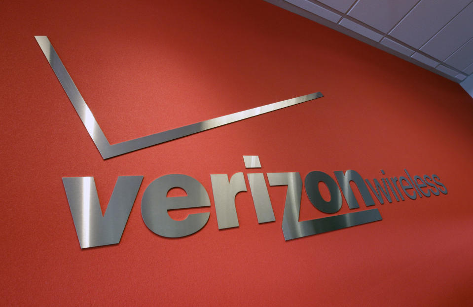 FILE - In this June 12, 2012 file photo, the Verizon logo is seen at Verizon store in Mountain View, Calif. Verizon is selling the segment of its business that includes Yahoo and AOL to private equity firm Apollo Global Management in a $5 billion deal. Verizon said Monday, May 3, 2021, that it will keep a 10% stake in the new company, which will be called Yahoo. (AP Photo/Paul Sakuma, File)