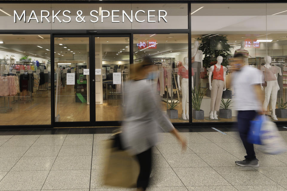 File - Shoppers pass a branch of British retail chain Marks & Spencer in London on Aug. 18, 2020. Marks & Spencer warned that shipping disruptions caused by attacks on ships in the Red Sea would delay new spring clothing and home goods collections that were due in February and March. (AP Photo/Kirsty Wigglesworth, File)