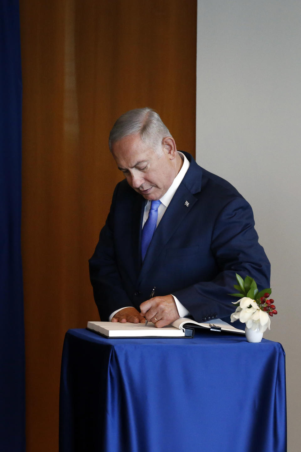 Israeli Prime Minister Benjamin Netanyahu signs the guest book while meeting with United Nations Secretary-General Antonio Guterres on the sidelines of the 73rd session of the United Nations General Assembly, at U.N. headquarters, Thursday, Sept. 27, 2018. (AP Photo/Jason DeCrow)