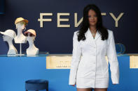 Rihanna poses as she unveils her first fashion designs for Fenty at a pop-up store in Paris, France, Wednesday, May 22, 2019. Singer Rihanna is the first black woman in history to head up a major Parisian luxury house, and the collection, named after the singer turned designer's last name, comprises of ready-to-wear, footwear, accessories, and eyewear and is available for sale Paris' Le Marais area from Friday and will debut online May 29. (AP Photo/Francois Mori)