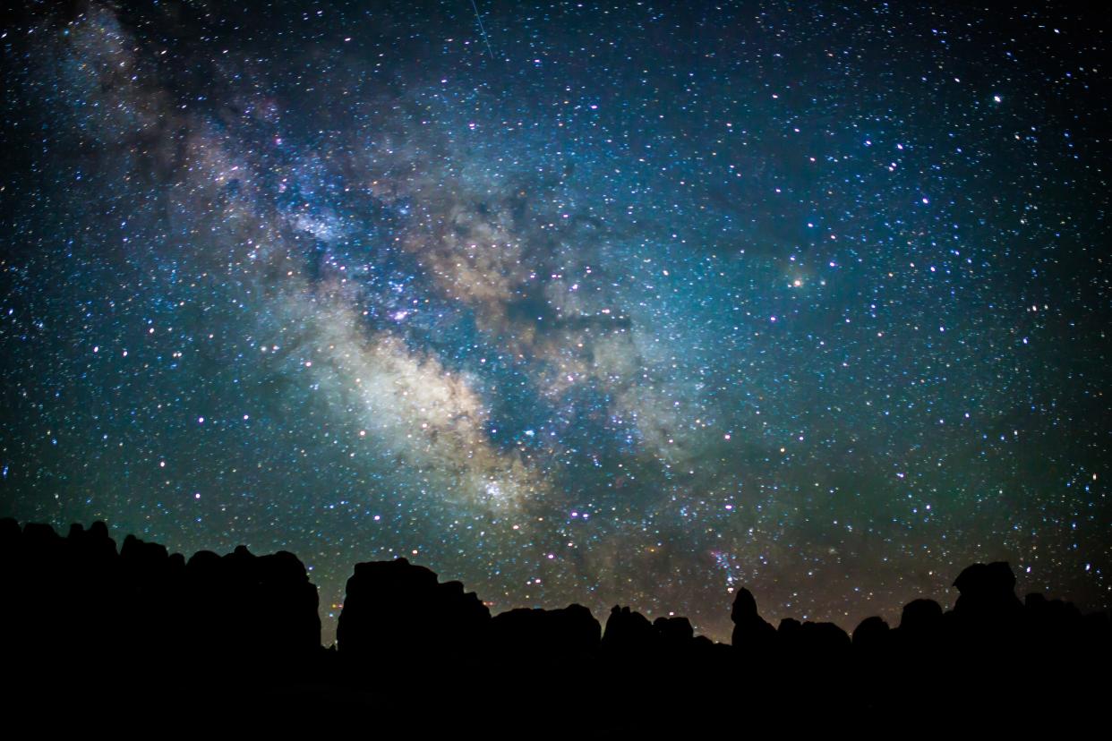The Milky Way shines bright over Chesler Park at Canyonlands National Park.