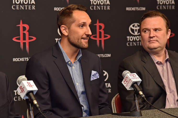 Rockets GM Daryl Morey (right) surely sold Ryan Anderson on more open looks in Houston. (Getty Images)