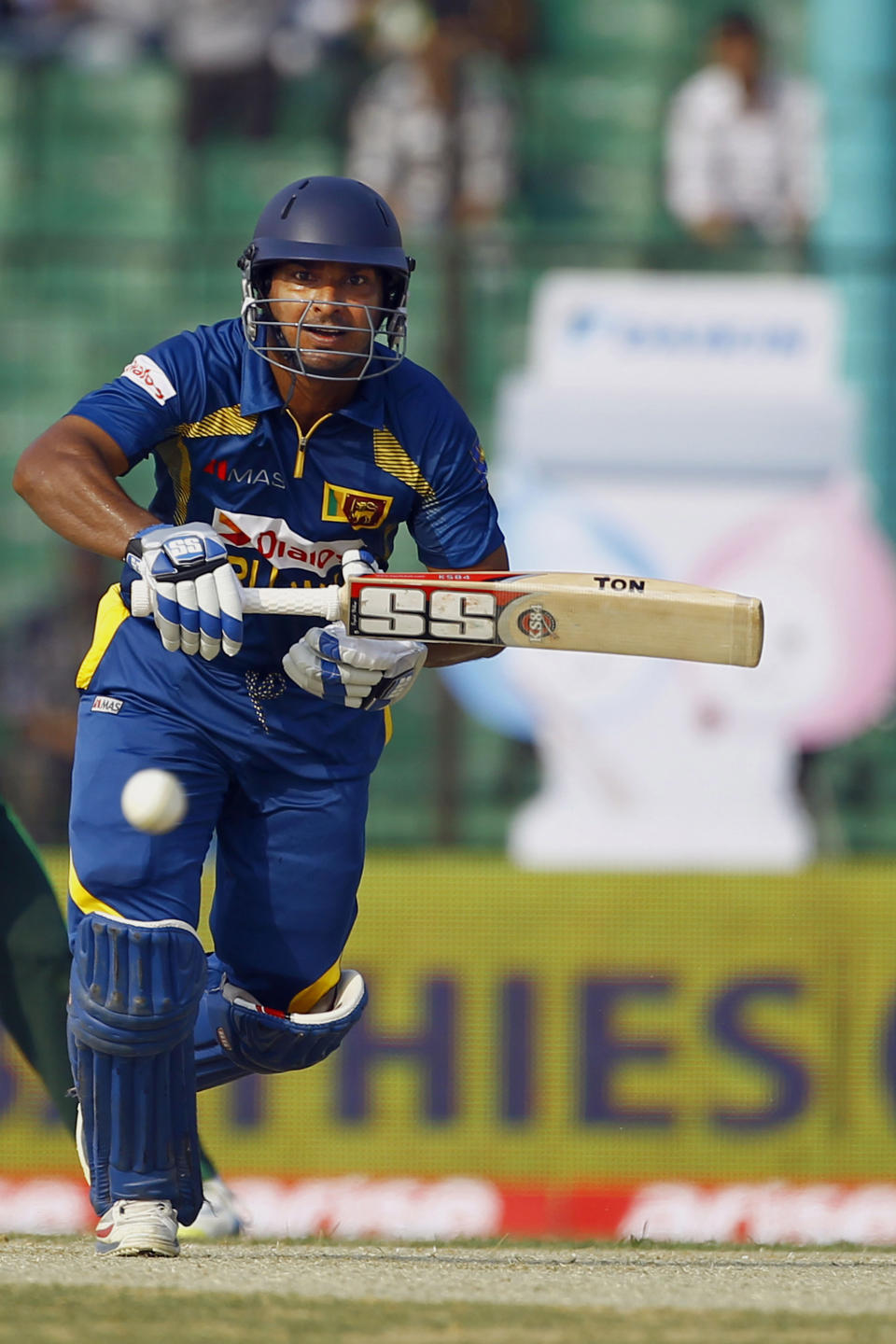 Sri Lanka’s Kumar Sangakkara plays a shot during the opening match of the Asia Cup one-day international cricket tournament against Pakistan in Fatullah, near Dhaka, Bangladesh, Tuesday, Feb. 25, 2014. (AP Photo/A.M. Ahad)