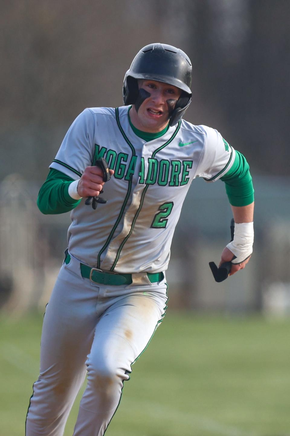 Mogadore shortstop John Dasco sprints around second base during Thursday night's game at Rootstown High School.